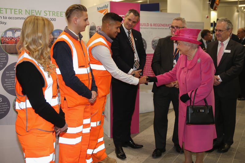 Queen Elizabeth II talks to Network Rail trainess during the official opening of the refurbished Birmingham New Street Station on November 19, 2015 (Photo by Christopher Furlong/Getty Images)