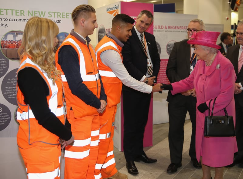 Queen Elizabeth II talks to Network Rail trainess during the official opening of the refurbished Birmingham New Street Station on November 19, 2015 (Photo by Christopher Furlong/Getty Images)