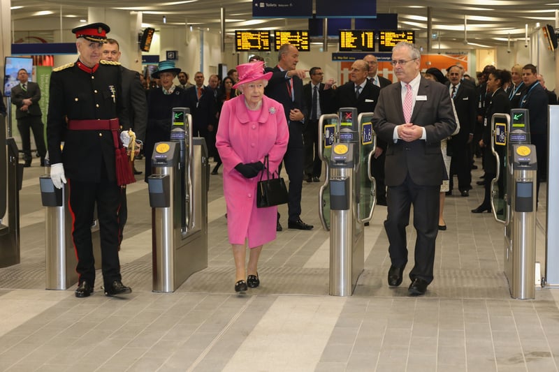 Queen Elizabeth II walks through the ticket barriers during the official opening of the refurbished Birmingham New Street Station on November 19, 2015 (Photo by Christopher Furlong/Getty Images)