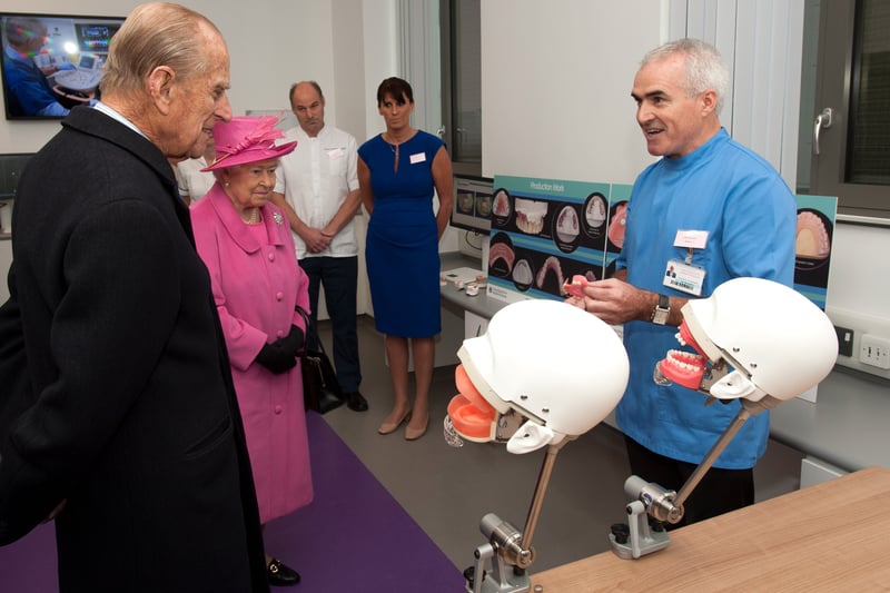 Queen Elizabeth II and Prince Philip, Duke of Edinburgh are shown Phantom Heads used to train dentists by Phil Murphy during a tour of the new Birmingham Hospital and School of Dentistry before officially opening the building, on November 19, 2015  (Photo by Richard Stonehouse - WPA Pool/Getty Images)