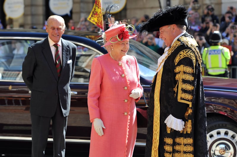 Queen Elizabeth II, accompanied by the Prince Phillip, Duke of Edinburgh, are greeted by the Lord Mayor of Birmingham Councillor John Lines as they arrive for her Diamond Jubilee visit (Photo by Tim Ireland - WPA Pool/Getty Images)