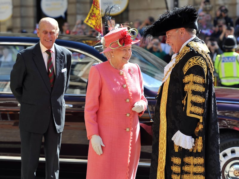 Queen Elizabeth II, accompanied by the Prince Phillip, Duke of Edinburgh, are greeted by the Lord Mayor of Birmingham Councillor John Lines as they arrive for her Diamond Jubilee visit (Photo by Tim Ireland - WPA Pool/Getty Images)