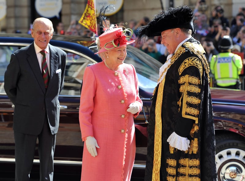 Queen Elizabeth II, accompanied by the Prince Phillip, Duke of Edinburgh, are greeted by the Lord Mayor of Birmingham Councillor John Lines as they arrive for her Diamond Jubilee visit (Photo by Tim Ireland - WPA Pool/Getty Images)