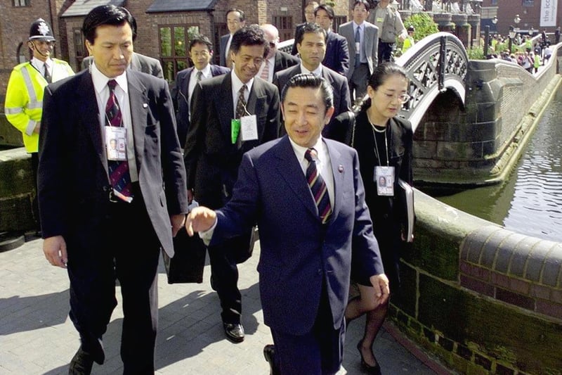 Japanese Prime minister Ryutaro Hashimoto walks with his delegation along the canal in Birmingham on May, 17 after he left the conference centre at the end of the G8 economic summit (Credit STEPHEN JAFFE/AFP via Getty Images)