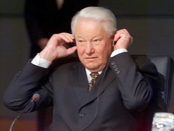  Russian President Boris Yeltsin adjusts his earphones as he attends the final session of the G8 economic summit held in Birmingham on May, 17 (Credit  STEPHEN JAFFE/AFP via Getty Images)