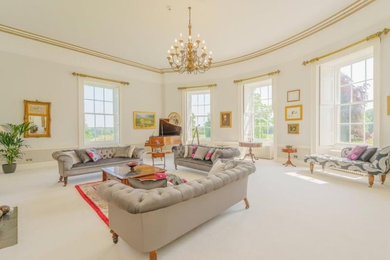 The inside of Milbourne Hall is just as well kept as its outside. You wouldn’t want any guests with a glass of red wine or even any mucky corgis in this living room! (Image: Rightmove)
