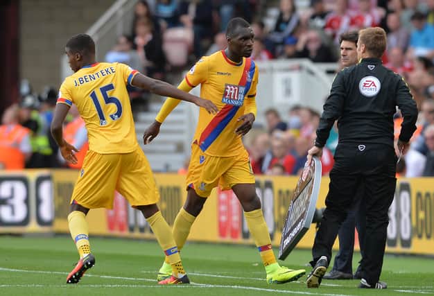 Christian Benteke of Crystal Palace is substituted for Jonathan Benteke (L), of Crystal Palace during the Premier League match  (Photo by Mark Runnacles/Getty Images) 
