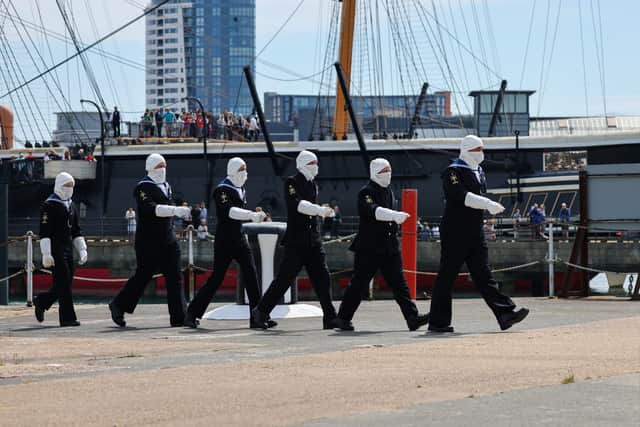 Sailors sounded the salute from Portsmouth Naval Base 
