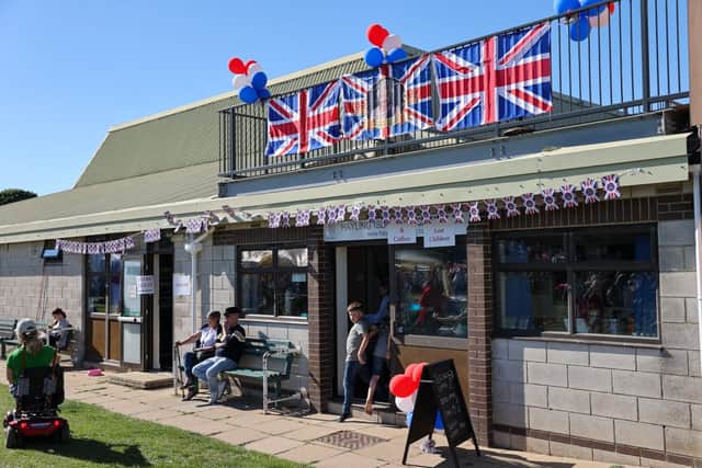 Bunting and Union Jacks draping one of the buildings in Hayling Park.