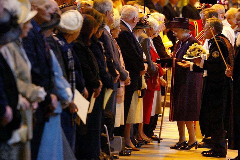 Queen Elizabeth II hands out maundy money during the Royal Maundy Service held at Liverpool’s Anglican Cathedral.
