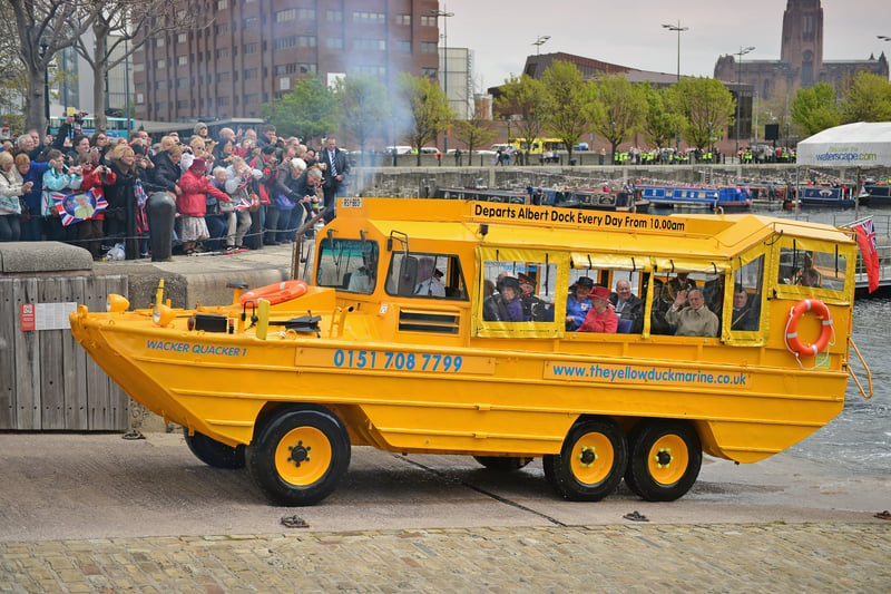 Queen Elizabeth II and Prince Philip, Duke of Edinburgh take a ride on the ‘Yellow Duckmarine’ an amphibious vehicle during a visit to Merseyside Maritime Museum. The Queen is visiting many parts of Britain as she celebrates her Diamond Jubilee.