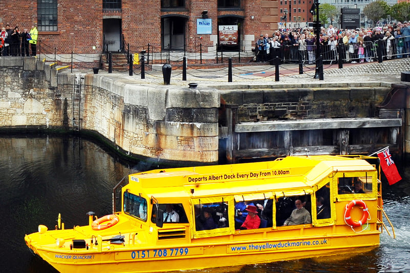 Queen Elizabeth II and Prince Phillip take to the water of the Royal Albert Dock aboard the ‘Yellow Duckmarine’.