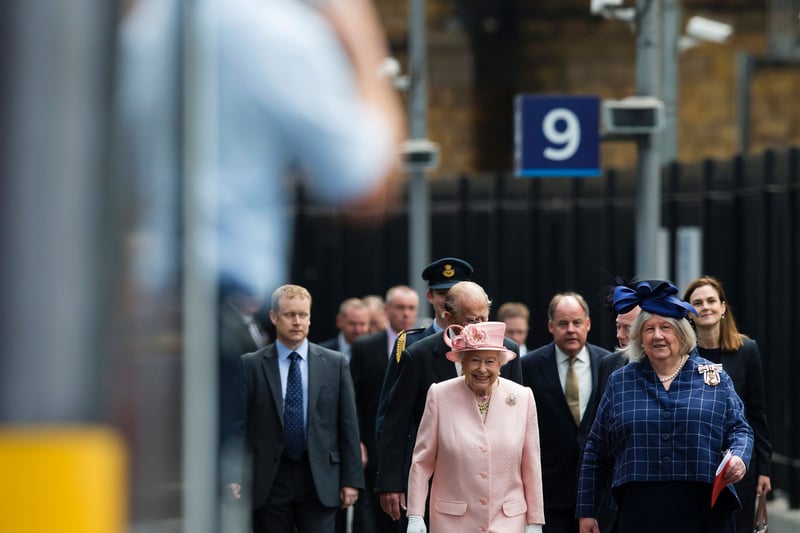 Queen Elizabeth II reacts as she walks along the platform after arriving by Royal Train at Liverpool Lime Street Station. The Queen, accompanied by her husband, Prince Philip, Duke of Edinburgh, has a day of engagements in Liverpool, where she will attend the International Festival for Business 2016, and officially open Alder Hey Children’s Hospital.