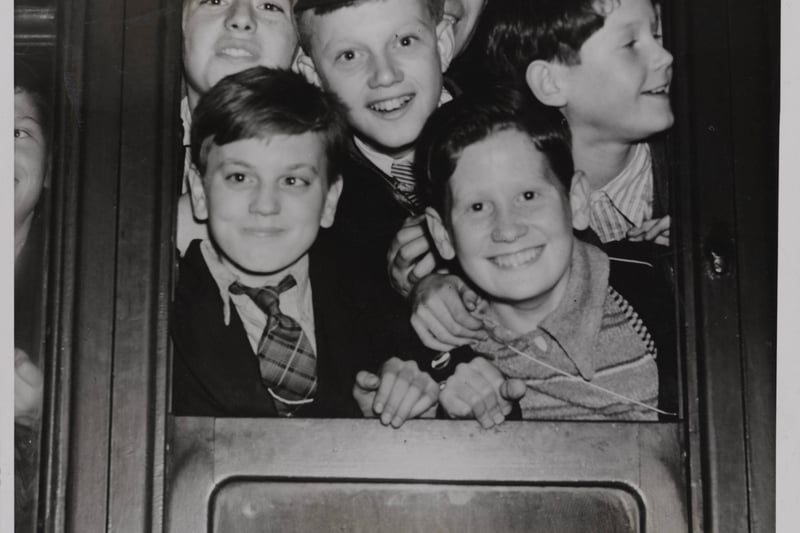 Children leaving by train from Victoria Station, Manchester, as part of mass evacuation; date not stated