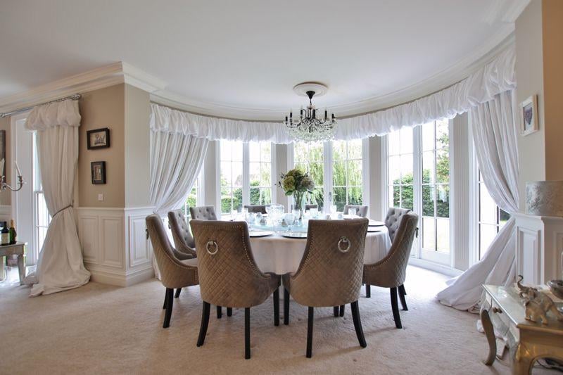 The room boasts a beautiful circular walk-in bay window, and dining area - within the formal lounge area.