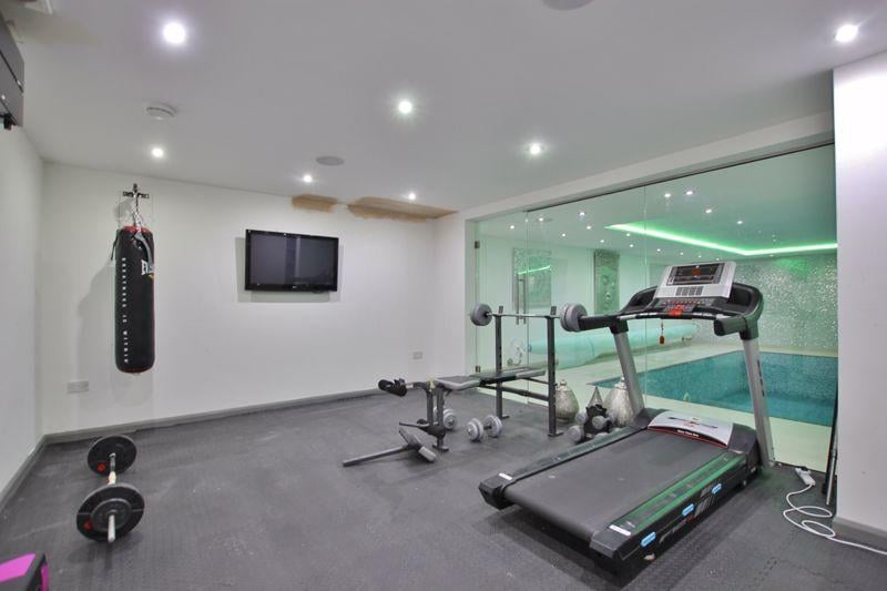 The lower ground floor is kitted out with a leisure suite which includes a gym.