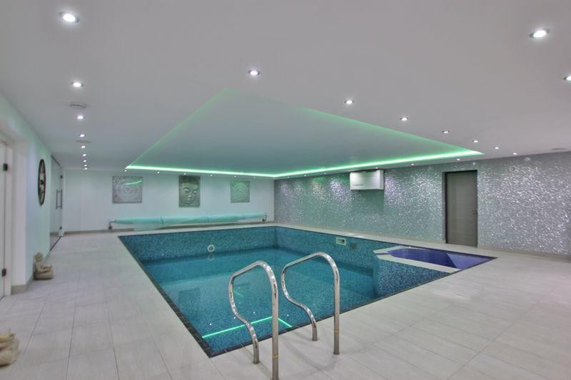 The lower ground leisure suite also boasts a swimming pool. The fifth bedroom and en suite, are also located on this floor. 