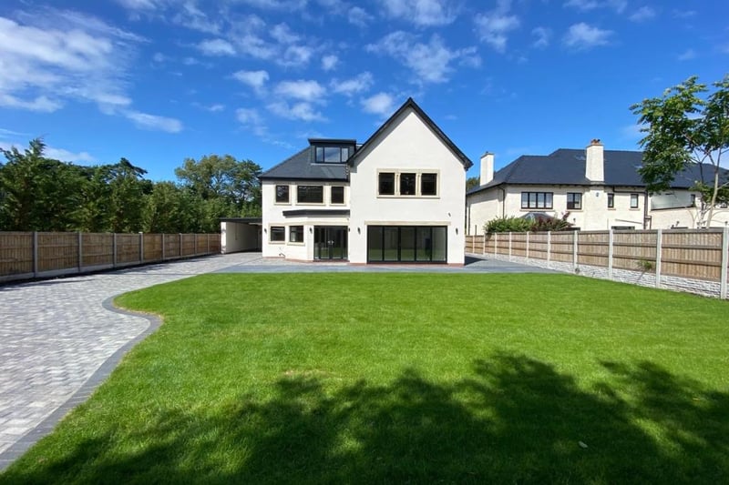 The garden is laid to lawn with an extensive limestone patio. Photo: Rightmove