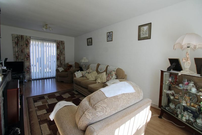There are two double bedrooms and one single. The kitchen is reasonably sized and has an additional storage area. 