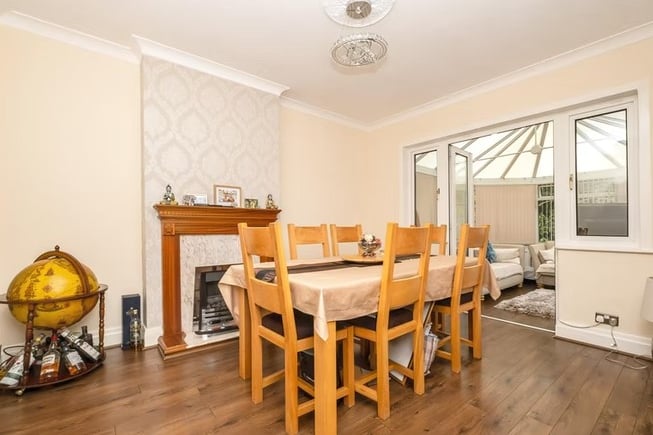 The dining room is spacious with a large attatched conservatory that is perfect for hosting guests