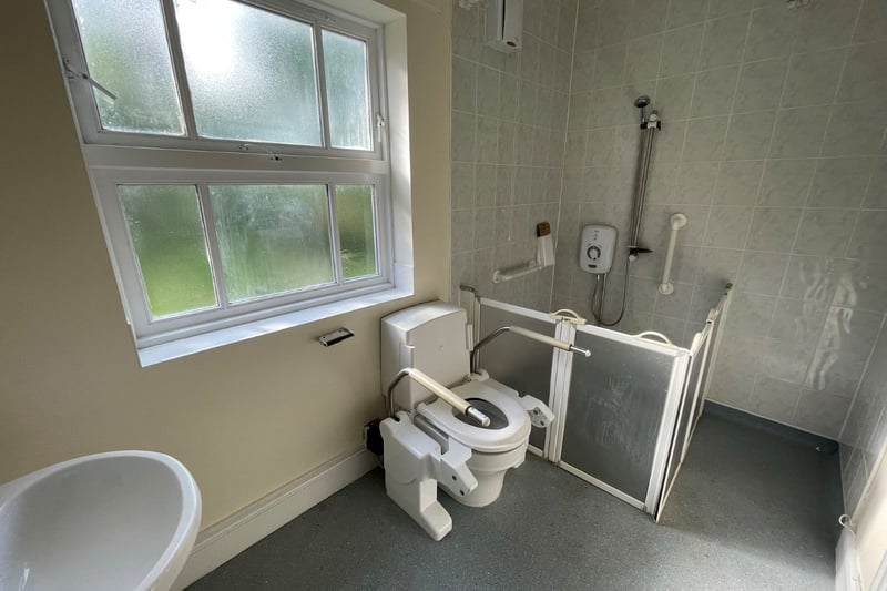 The wet room has a disabled access toilet and shower cubicle. 