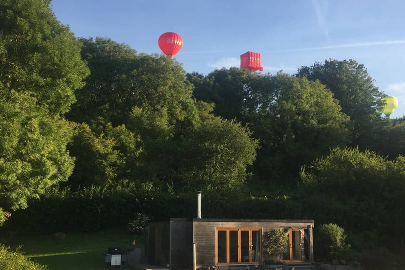 You don’t get much more Bristol than sitting soaking up the sun with balloons flying overhead