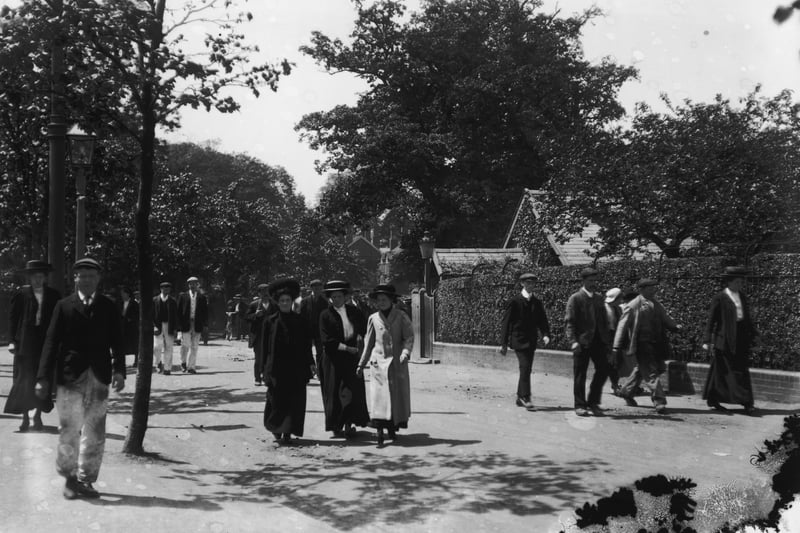 Employees leaving the Cadbury’s chocolate works in Bournville Village near Birmingham, a new town founded by Chocolate manufacturer and social reformer George Cadbury.
