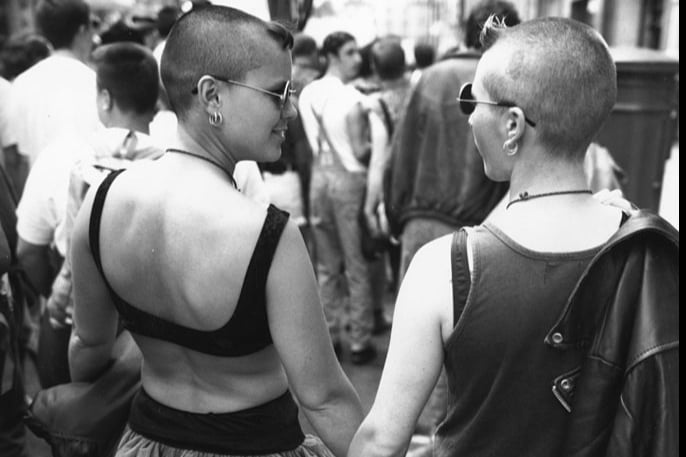 A couple hold hands during the annual Gay Pride march through central London, June 19 1993. 