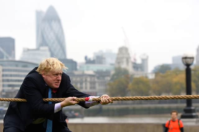 Mayor of London Boris Johnson competes in a tug of war during the launch of London Poppy Day on October 27, 2015 in London, England. 