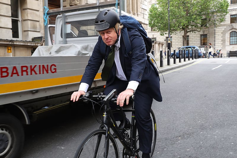 Former Mayor of London Boris Johnson cycles past Portcullis House on June 15, 2016 in London, England.  
