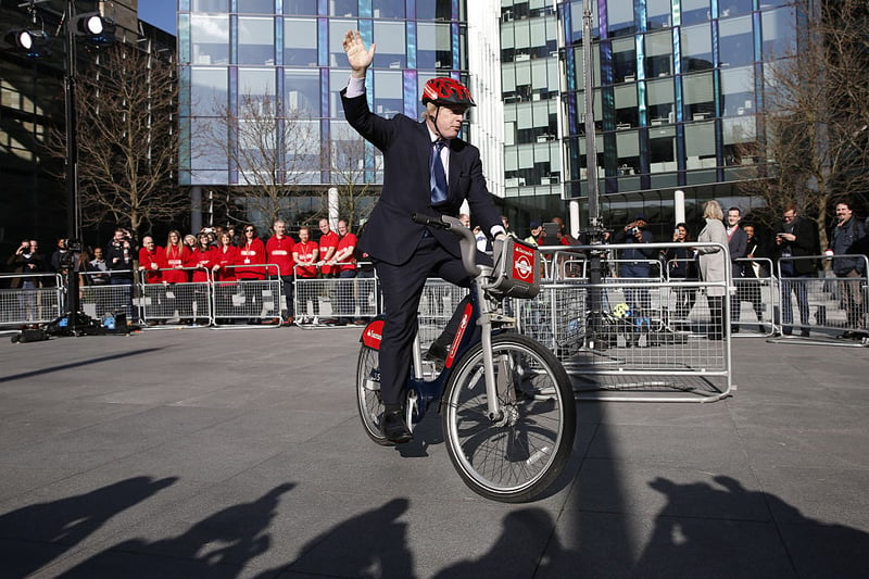 Mayor of London, Boris Johnson rides a bicycle during the announcement of Santander as the new sponsor of Santander Cycles in 2015.