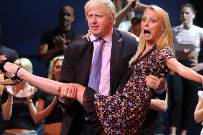 Mayor of London Boris Johnson holds Dance Champion Camilla Dallerup at the launch of the T-Mobile Big Dance 2010 at The London Palladium on July 1, 2010.