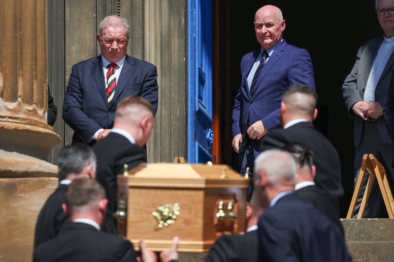 Ally McCoist and John Brown look on as the coffin o Andy Goram is carried into Wellington Church in Glasgow