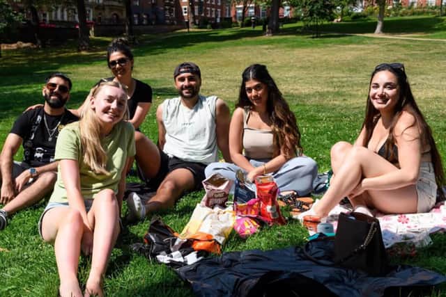  A group of friends enjoying the sun in Winckley Square. 