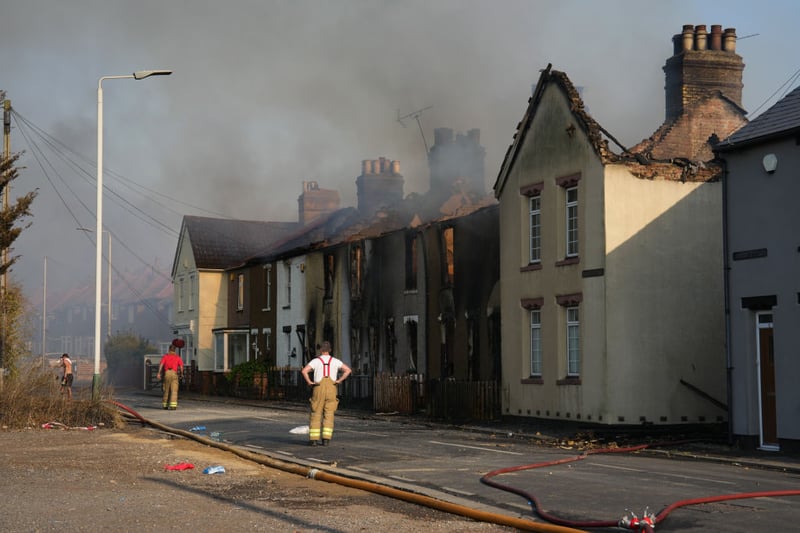Black smoke billowed into the air as the blaze spread, while a rescue centre for residents was set up.