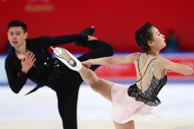 China pair Peng Cheng (right) and Jin Yang (left) compete during the 2019 Grand Prix of Figure Skating