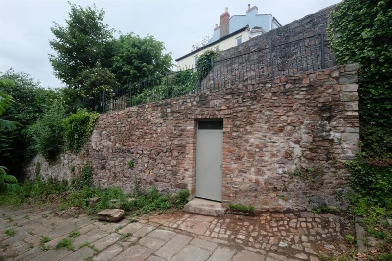 The property is accessed by a grey door built into the walls. Again, you’d never know it’s there!