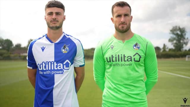 Aaron Collins (L) and James Belshaw (R) pose in the new Bristol Rovers home strip and goalkeeper shirt. (Image: Bristol Rovers FC)