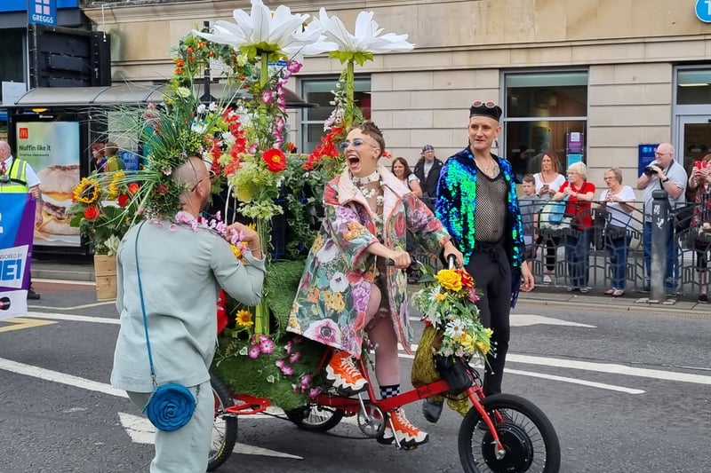 One member of the parade adorned a bike with flowers galore.