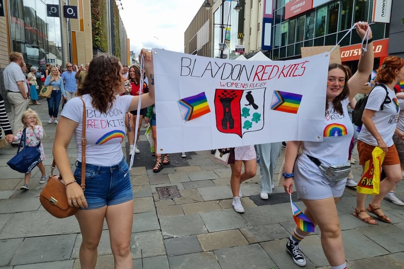 A local women’s rugby team join the march.
