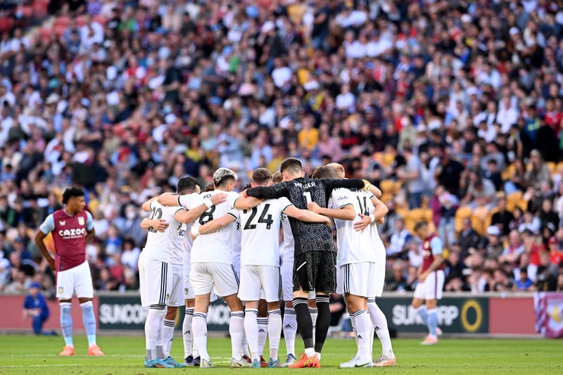The Leeds players embrace during the 2022 Queensland Champions Cup match between Aston Villa and Leeds United (Photo by Bradley Kanaris/Getty Images)
