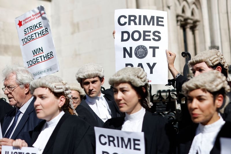 Hundreds of criminal barristers have been campaigning for an increase in their rates of pay, involving extensive strike action.

While currently on hold for a week, barristers began refusing to attend court on 27 June, initially for one day of the week, building up to a full five-day walkout from 18 to 22 July.

Another five-day walkout will begin on 1 August, and will be repeated every other week until the government commits to increasing rates, according to the Criminal Bar Association (CBA). 

Despite misconceptions that all barristers earn high-salaries, criminal defence barristers - particularly early in their career - can earn the equivalent of minimum wage or less, as the legal aid rates have not been increased in several years.  

Industrial action began in April, when many barristers opted a ‘no returns’ policy, meaning they refused to pick up cases returned by other barristers who are unable to attend. 

With significant backlogs in the criminal courts system already, the ‘no return’ policy was taken as a first step, with 94% of CBA members voting to accept the ‘no return policy’.

In response to the action the government has committed to increasing rates by 15%, although this was the minimum uplift recommended by an independent review carried out prior to the recent spike in inflation.

Barristers have criticised this increase, which the government has said will only apply to cases beginning from September onwards and will not be applied to existing cases, meaning the rise will not be felt for some time. 