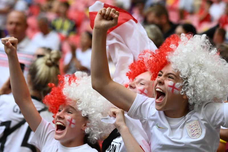 Fans cheer on England during the final at Wembley.