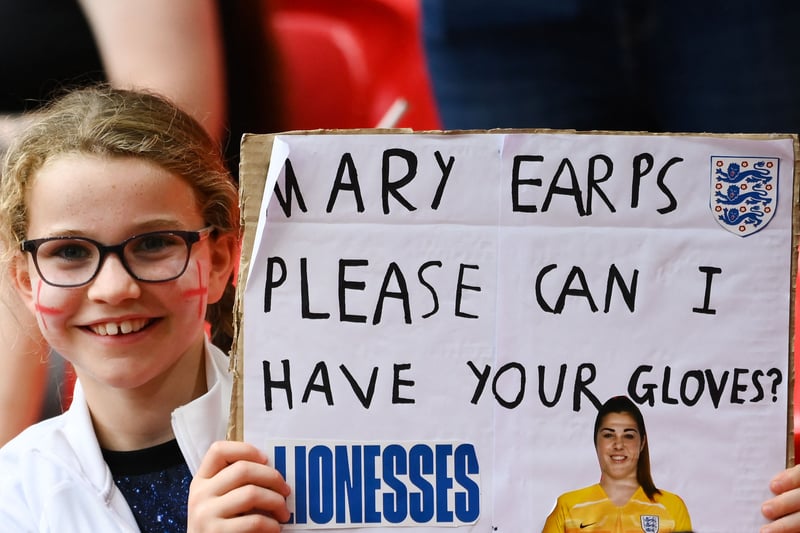 England’s fan holds a placard as she cheers for her team prior to the UEFA Women’s Euro 2022 final football match between England and Germany.