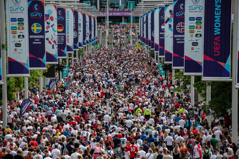 Football fans arrive at Wembley stadium for the final of the UEFA Euro Women’s Championship.