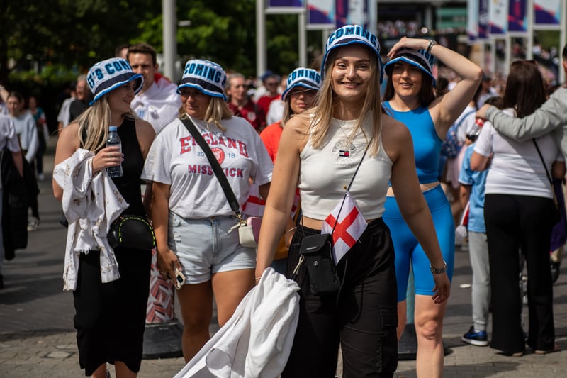 Football fans arrive at Wembley stadium for the final of the UEFA Euro Women’s Championship.
