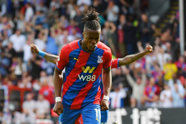  Wilfried Zaha of Crystal Palace celebrates after scoring their sides first goal during the Premier League (Photo by Tom Dulat/Getty Images)
