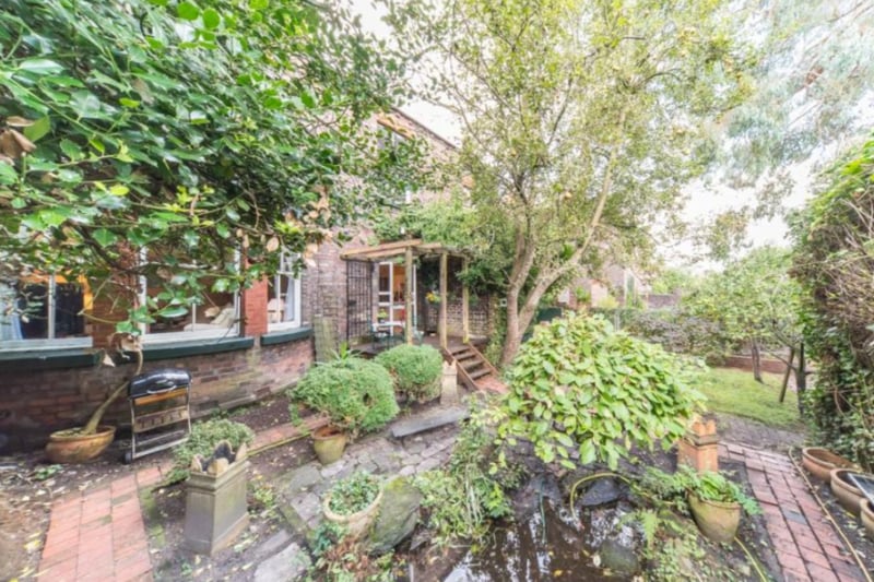 This gorgeous property has a large rear garden, historic features and bay windows.