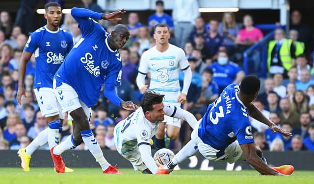 Ben Chilwell of Chelsea is brought down in the box after being challenged by Abdoulaye Doucoure of Everton during the Premier League match between Everton FC and Chelsea FC at Goodison Park on August 06, 2022 in Liverpool, England. (Photo by Michael Regan/Getty Images)