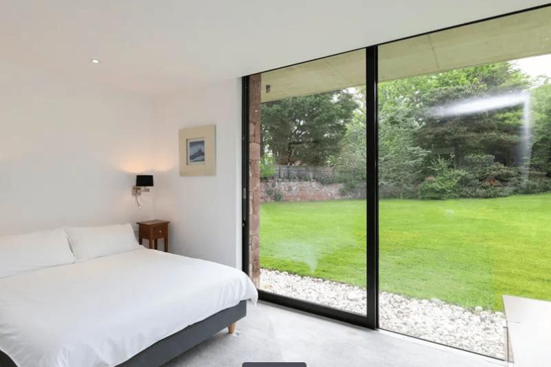 Each of the six bedrooms have large windows, views of the garden and modern features.